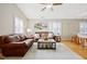 Inviting living room with hardwood floors, neutral paint, and lots of natural light at 912 Homestead Park Dr, Apex, NC 27502
