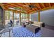 Back patio with furniture and ceiling fan offers a comfortable space to relax outdoors and enjoy nature at 912 Homestead Park Dr, Apex, NC 27502