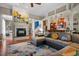 Cozy living room with fireplace, colorful area rug, and great flow to the kitchen at 920 Chapanoke Rd, Raleigh, NC 27603