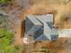 Aerial view of the home showing the roofline, patio area, and mature trees on the property at 94 Fawn Hill Ct, Garner, NC 27529