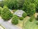 Aerial view of a home surrounded by lush trees, highlighting its serene and private setting at 94 Fawn Hill Ct, Garner, NC 27529
