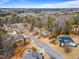 Spacious neighborhood showcasing homes with mature trees, providing a serene and private setting for residents at 94 Fawn Hill Ct, Garner, NC 27529