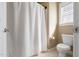 Neutral bathroom features a toilet and tiled floor, offering a clean and functional space at 94 Fawn Hill Ct, Garner, NC 27529