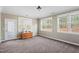 Bright bedroom featuring three windows and a wooden chest for ample natural light and storage at 94 Fawn Hill Ct, Garner, NC 27529