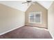 Bedroom with vaulted ceiling, plush carpet, neutral paint and natural light at 94 Fawn Hill Ct, Garner, NC 27529