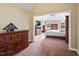 Spacious bedroom provides neutral color palette and furnishings, window overlooking treeline at 94 Fawn Hill Ct, Garner, NC 27529