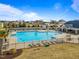 Community pool features a fenced area, lounge chairs, palm trees and plenty of space for residents to relax and enjoy the outdoors at 94 Fawn Hill Ct, Garner, NC 27529