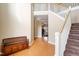 A welcoming two-story foyer features a staircase, wood floors, and natural light at 94 Fawn Hill Ct, Garner, NC 27529