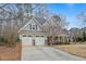 Attractive home with three-car garage, traditional design elements, and a covered front porch at 94 Fawn Hill Ct, Garner, NC 27529
