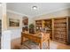 A cozy home office features custom shelves, a wooden desk, and a neutral color palette at 94 Fawn Hill Ct, Garner, NC 27529