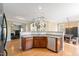 Open kitchen area with stainless steel appliances, hardwood floors and views of living spaces at 94 Fawn Hill Ct, Garner, NC 27529
