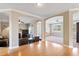 Open-concept living room showcasing hardwood floors and arched entryways to other rooms at 94 Fawn Hill Ct, Garner, NC 27529