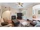 Inviting living area with fireplace, large TV, and smooth transition into another room at 94 Fawn Hill Ct, Garner, NC 27529