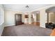 Inviting living room with neutral colors, seamless flow, and dark wood furniture at 94 Fawn Hill Ct, Garner, NC 27529