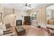 Comfortable living room with a fireplace and large windows, providing ample natural light at 94 Fawn Hill Ct, Garner, NC 27529