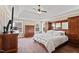 Spacious main bedroom with tray ceilings and large dresser at 94 Fawn Hill Ct, Garner, NC 27529