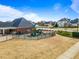 Community playground with modern equipment and well-maintained landscaping, offering Gathering fun at 94 Fawn Hill Ct, Garner, NC 27529