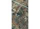 Aerial view of a property surrounded by trees and adjacent houses at 1008 Torredge Rd, Durham, NC 27712