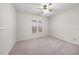 Neutral bedroom with carpet, a ceiling fan and a double window at 1008 Torredge Rd, Durham, NC 27712