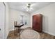 Bright bedroom featuring wood-look floors, a desk, and a large wardrobe at 1008 Torredge Rd, Durham, NC 27712