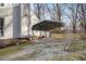 Gravel driveway to covered carport which provides shelter for your vehicles and protects from the elements at 1008 Torredge Rd, Durham, NC 27712