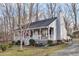 Charming single Gathering home boasts a cozy front porch, trimmed landscaping, and a welcoming atmosphere at 1008 Torredge Rd, Durham, NC 27712