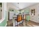 The kitchen is bright and features a breakfast bar and green cabinetry at 1008 Torredge Rd, Durham, NC 27712