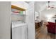 Convenient laundry room with a washing machine and shelving for storage at 1008 Torredge Rd, Durham, NC 27712