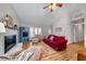 Bright living room boasts a fireplace, and an area rug for a cozy gathering space at 1008 Torredge Rd, Durham, NC 27712