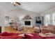 Bright living room features vaulted ceilings, cozy fireplace, and comfortable seating, perfect for relaxing at 1008 Torredge Rd, Durham, NC 27712