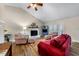Cozy living room features a red sofa, fireplace, and matching chairs for a comfortable gathering space at 1008 Torredge Rd, Durham, NC 27712