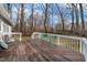Enjoy this spacious rear deck with ample seating, ideal for relaxing and enjoying the serene outdoor setting at 1008 Torredge Rd, Durham, NC 27712
