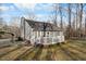 Rear exterior view featuring a private deck, providing a perfect space for outdoor relaxation and entertaining at 1008 Torredge Rd, Durham, NC 27712
