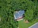 Aerial view of the home nestled among lush green trees at 102 Legault Dr, Cary, NC 27513