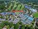 Aerial view of Prestonwood Country Club with golf course, tennis courts, and clubhouse facilities at 102 Legault Dr, Cary, NC 27513