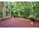 Wooden deck with stairs leading to a large green yard, ideal for outdoor living at 102 Legault Dr, Cary, NC 27513