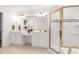 A bright bathroom features a double vanity, a standing shower, and tile floors at 102 Legault Dr, Cary, NC 27513