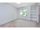 This bright bedroom has a neutral color palette and includes a built-in bookcase at 102 Legault Dr, Cary, NC 27513
