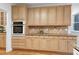 Kitchen with granite counters, ample storage, and stainless oven at 102 Legault Dr, Cary, NC 27513