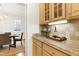 Well-appointed kitchen with granite counters and wood cabinetry at 102 Legault Dr, Cary, NC 27513