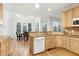 Well-lit kitchen featuring wood cabinetry and modern appliances at 102 Legault Dr, Cary, NC 27513