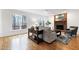 Bright living room with a brick fireplace and large windows at 102 Legault Dr, Cary, NC 27513