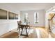 Sunlit office space featuring hardwood floors, white walls, and a traditional-style desk at 102 Legault Dr, Cary, NC 27513