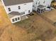 Aerial view of houses and yards, including a home with a screened-in porch at 1026 Janiskee Rd, Durham, NC 27703