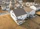 Aerial view showcasing the back of a home, landscaping, and neighborhood layout at 1026 Janiskee Rd, Durham, NC 27703