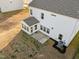 Aerial of a home with a sunroom addition, patio, and well maintained yard at 1026 Janiskee Rd, Durham, NC 27703