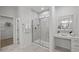 Bathroom featuring a glass enclosed shower, makeup vanity and tile flooring at 1026 Janiskee Rd, Durham, NC 27703