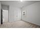 Bright bedroom features neutral carpet, a window, and a closet for storage at 1026 Janiskee Rd, Durham, NC 27703