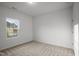 Bedroom with a window, neutral paint and carpet at 1026 Janiskee Rd, Durham, NC 27703