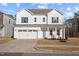 Beautiful two-story home with a two-car garage, well-kept lawn, and inviting curb appeal at 1026 Janiskee Rd, Durham, NC 27703